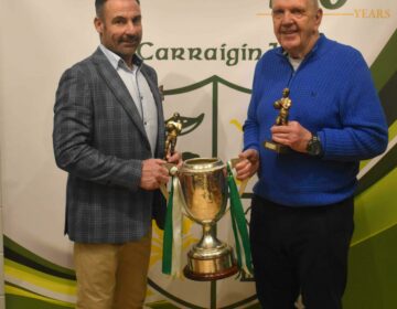 1999 captain Michael Johnston and 1974 captain Packie Mc Guckin with the championship trophy